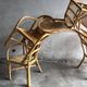 Set of 8 Manou rattan chairs with cane backrest.