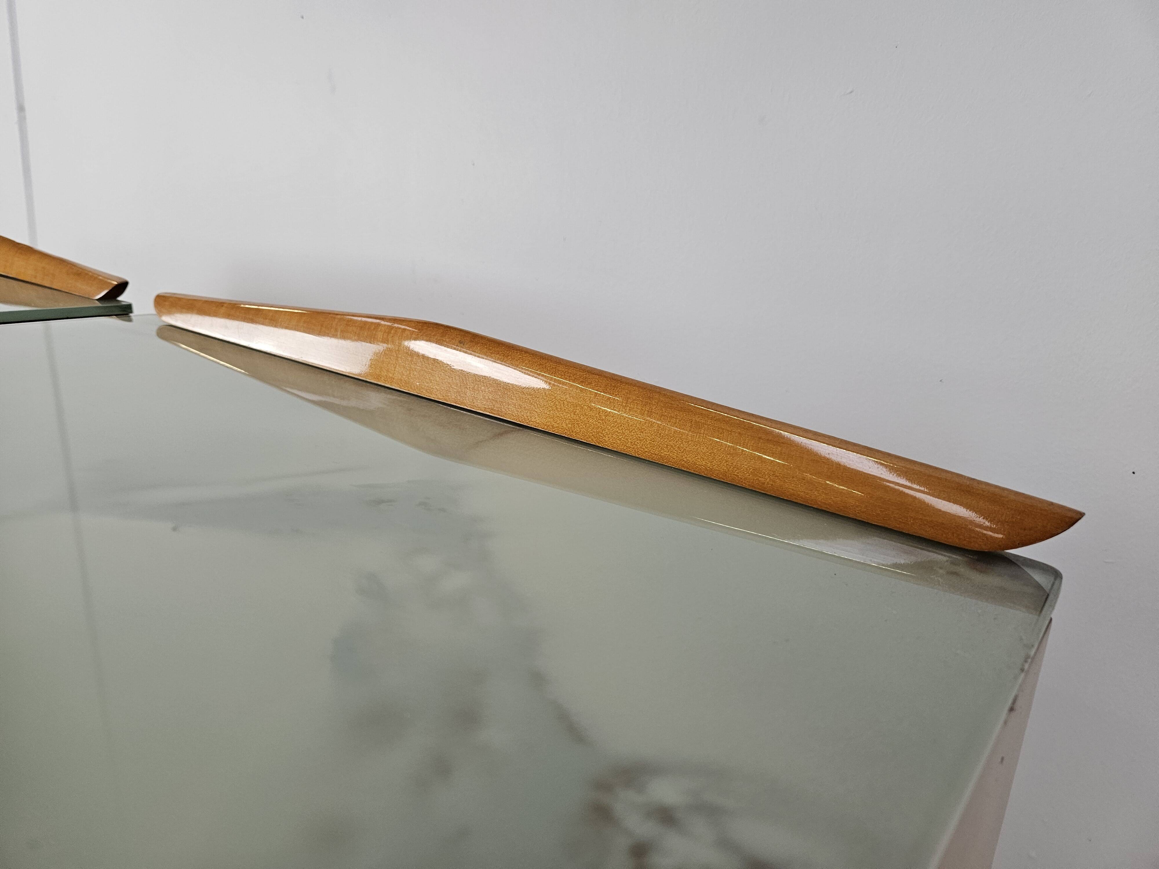 Mid-century nightstands in maple, brass, and glass