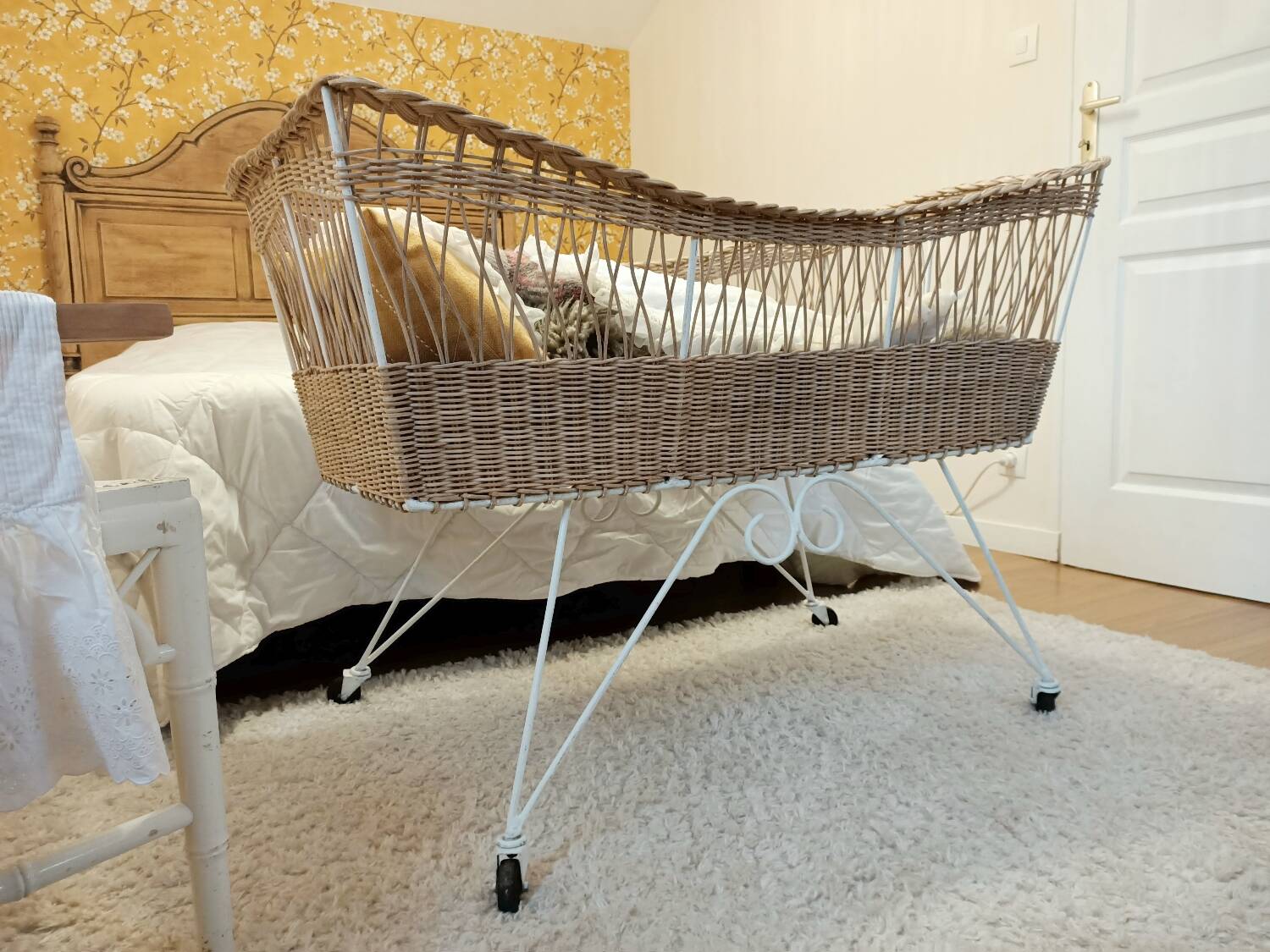 Rattan and wrought iron cradle