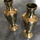 Pair of golden brass vases with floral frieze pattern 27.5 cm