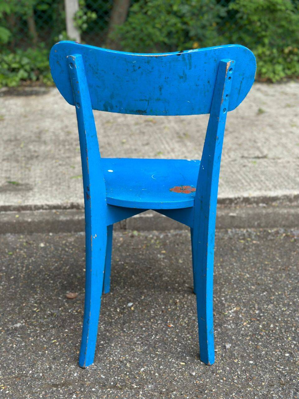 Child's chair in vintage or rustic wood style from the 1960s.