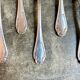 6 small silver metal spoons