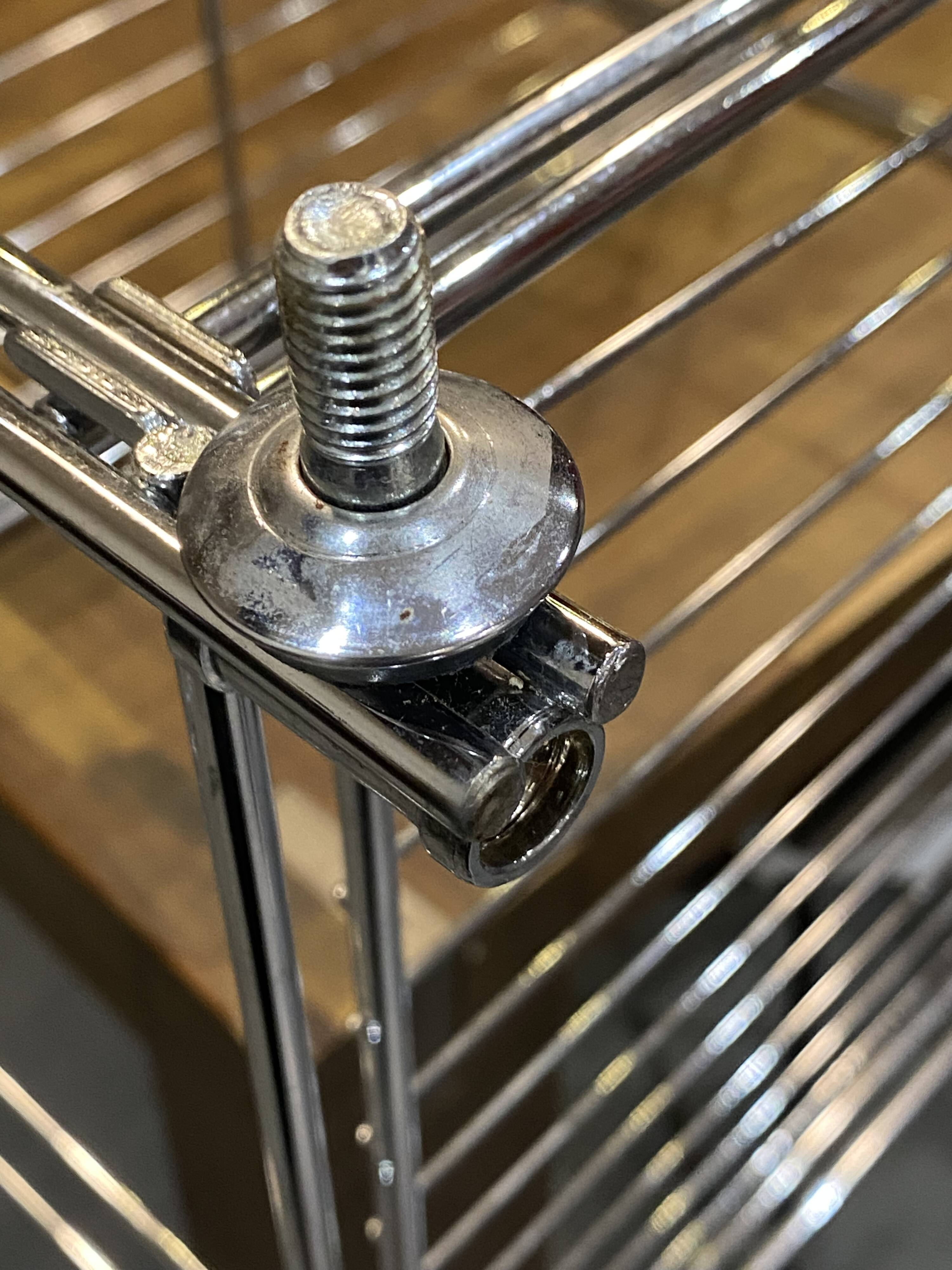 Modular wall bookshelf desk in vintage chrome.