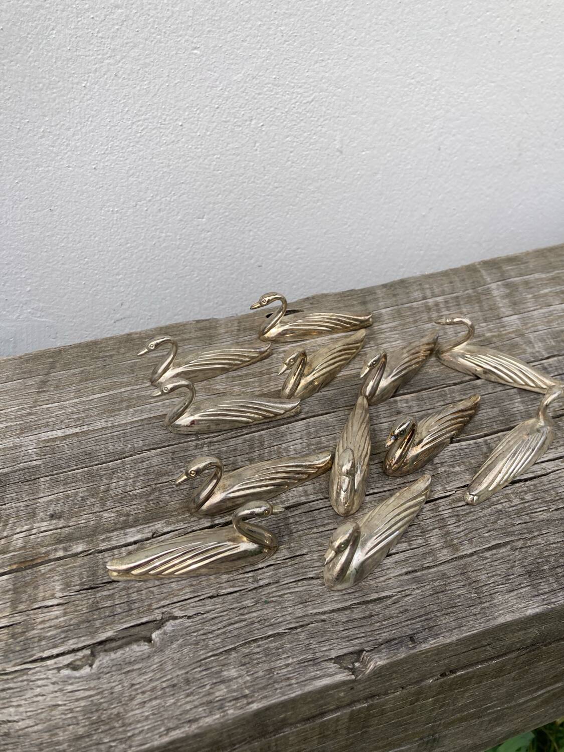 12 duck knife holders in silver metal