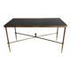 Neoclassical brass coffee table with a black leather top and golden borders from Maison Jansen.