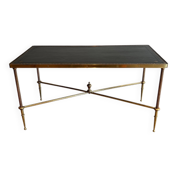 Neoclassical brass coffee table with a black leather top and golden borders from Maison Jansen.
