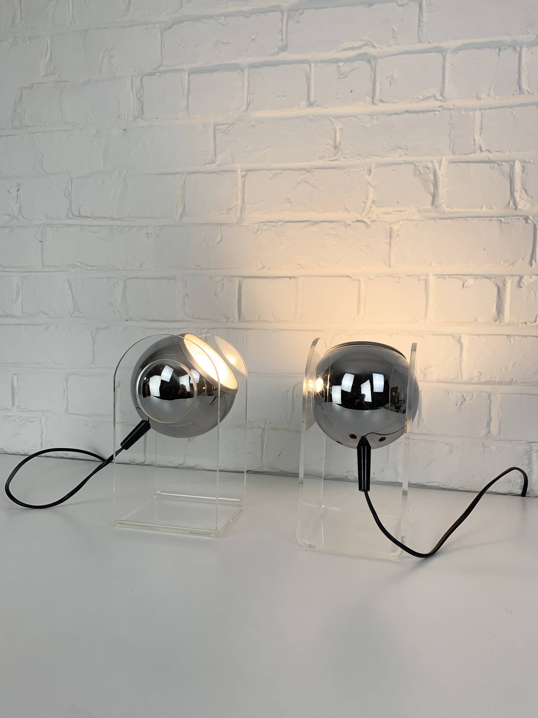 Pair of space age chrome plexiglass sphere table lamps from the 70s