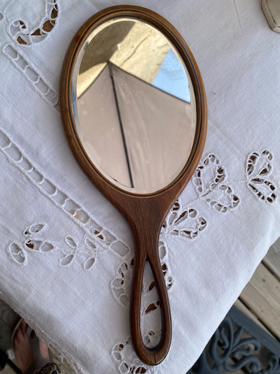 Hand-facing wooden mirror