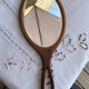 Hand-facing wooden mirror