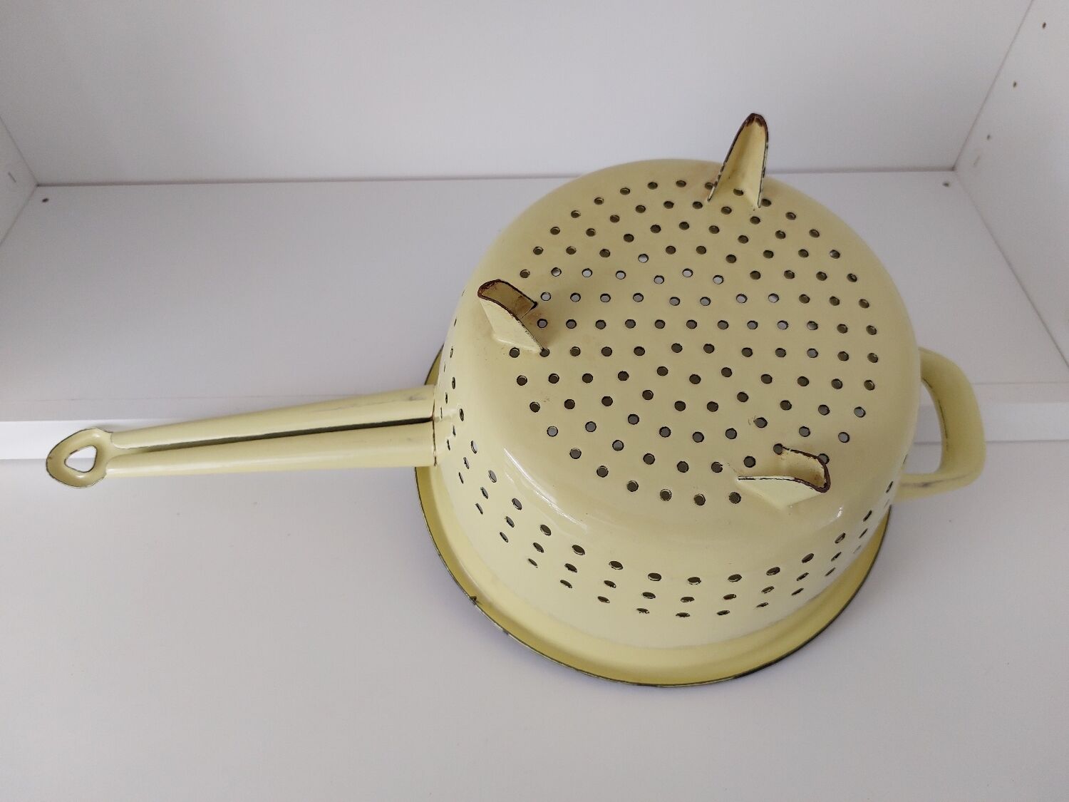 Vintage yellow enamelled strainer