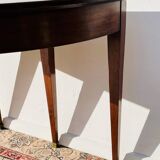 Empire-style demi-lune console from the 19th century.