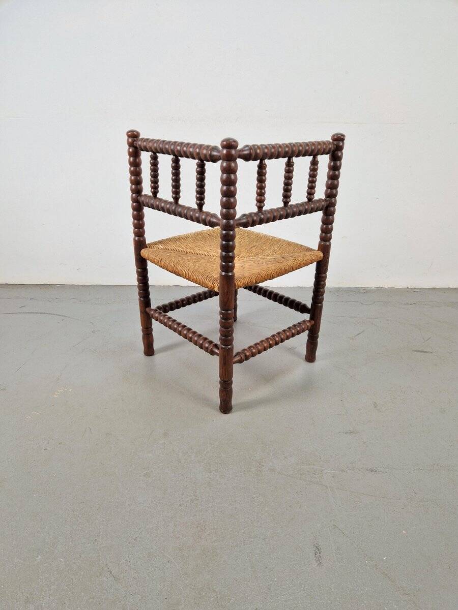 Corner chair in Arts and Crafts style made of oak with a rush seat, 1950s.