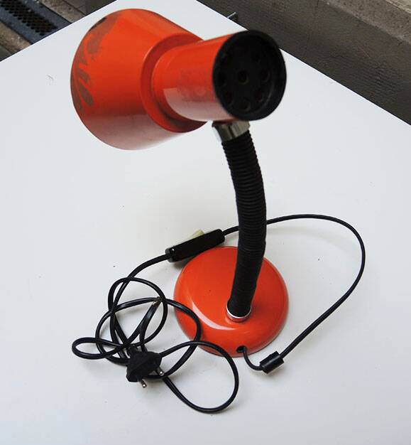 Old orange enameled sheet metal lamp