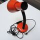 Old orange enameled sheet metal lamp
