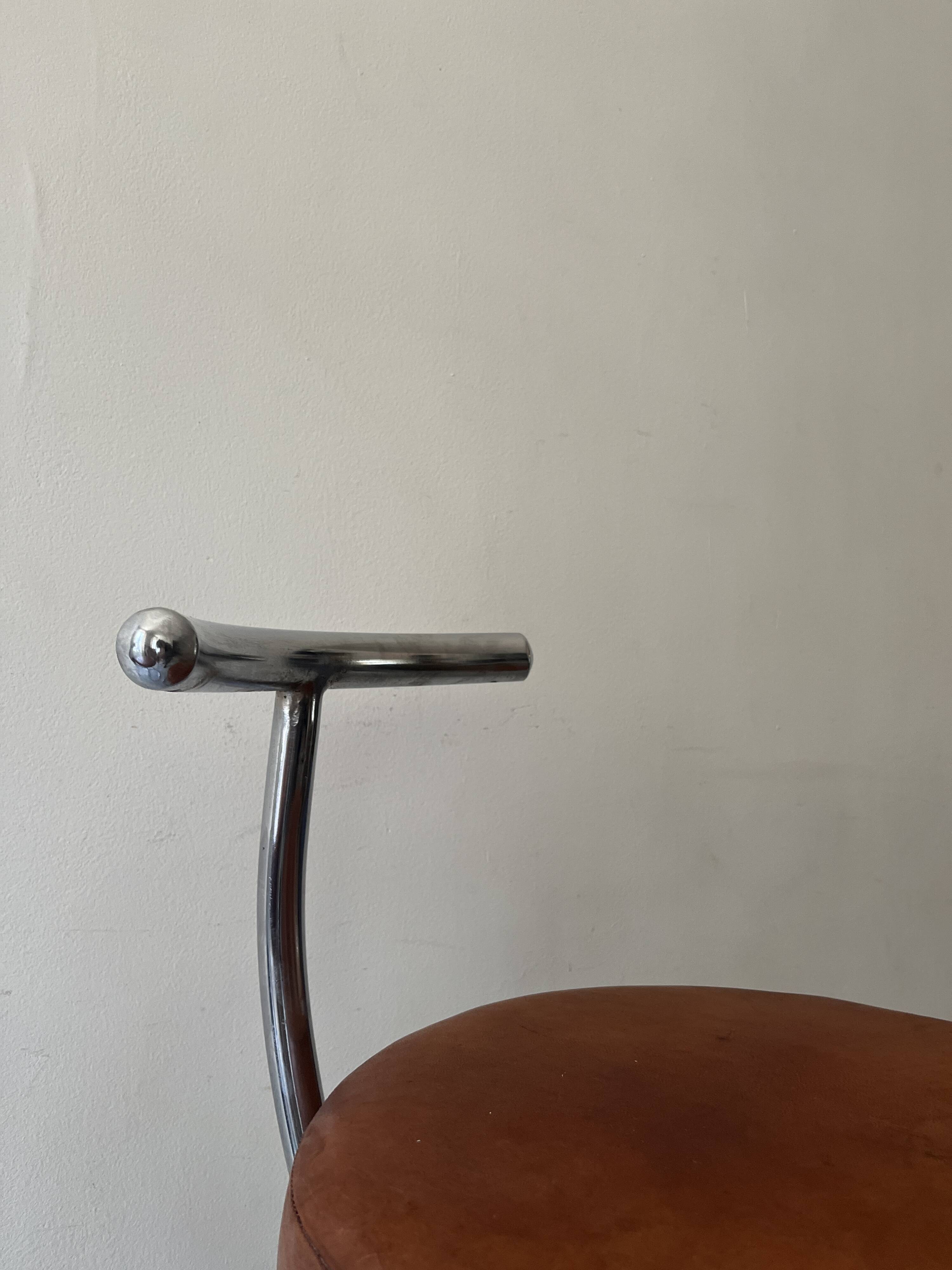 Bar stools in tubular chrome and tan leather, 1970s