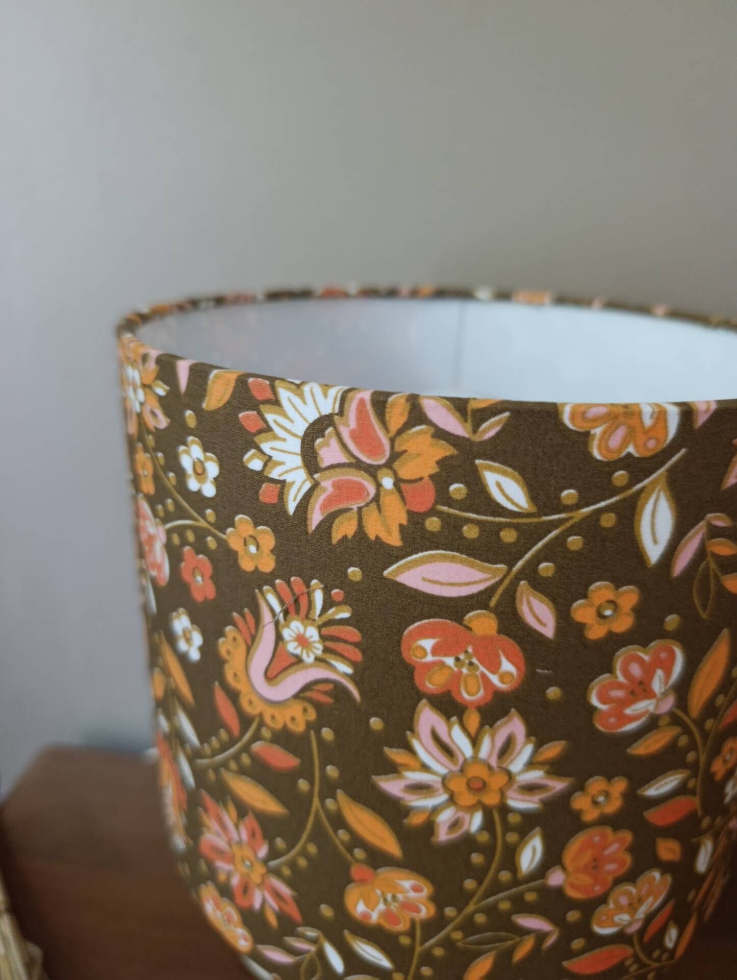 Table lamp with a wooden ball base, floral print in bohemian style.