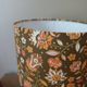 Table lamp with a wooden ball base, floral print in bohemian style.