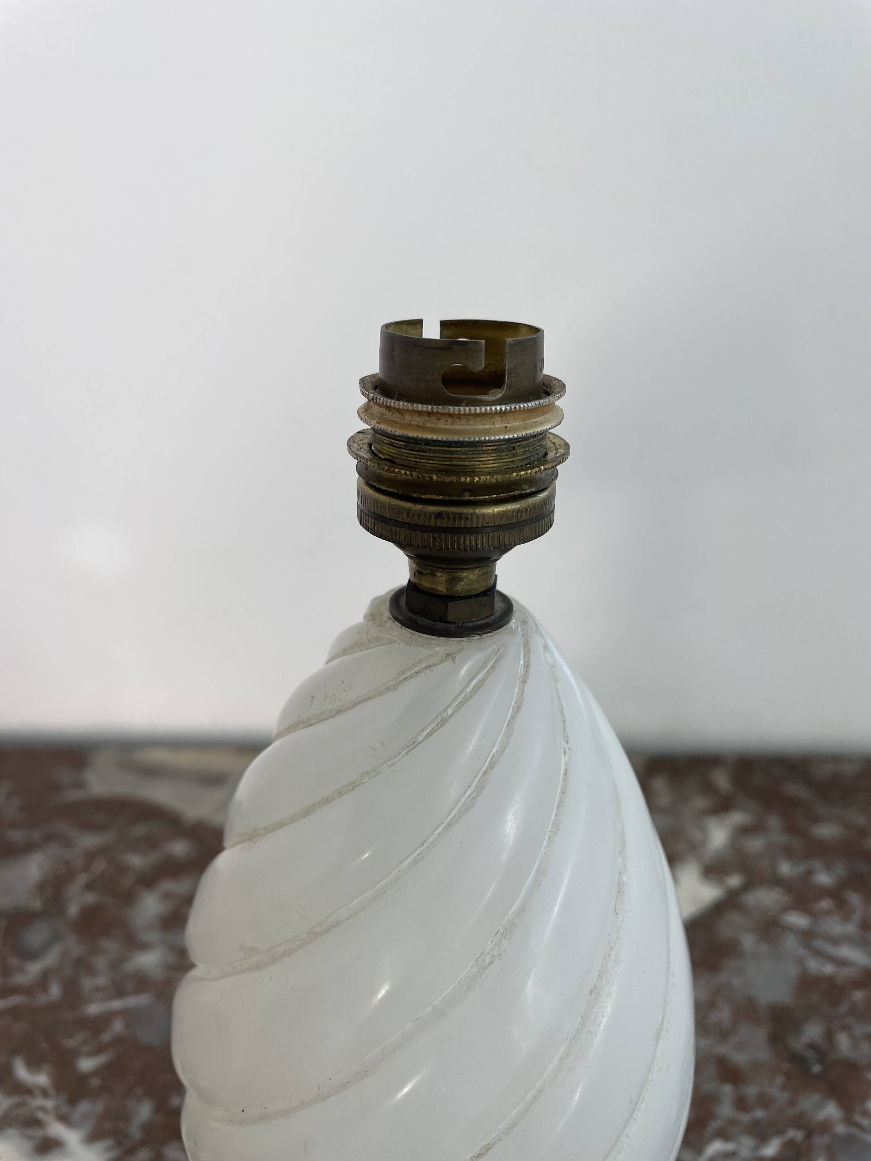 Alabaster lamp, twisted, gadroon decoration, gilded brass base, dolphins