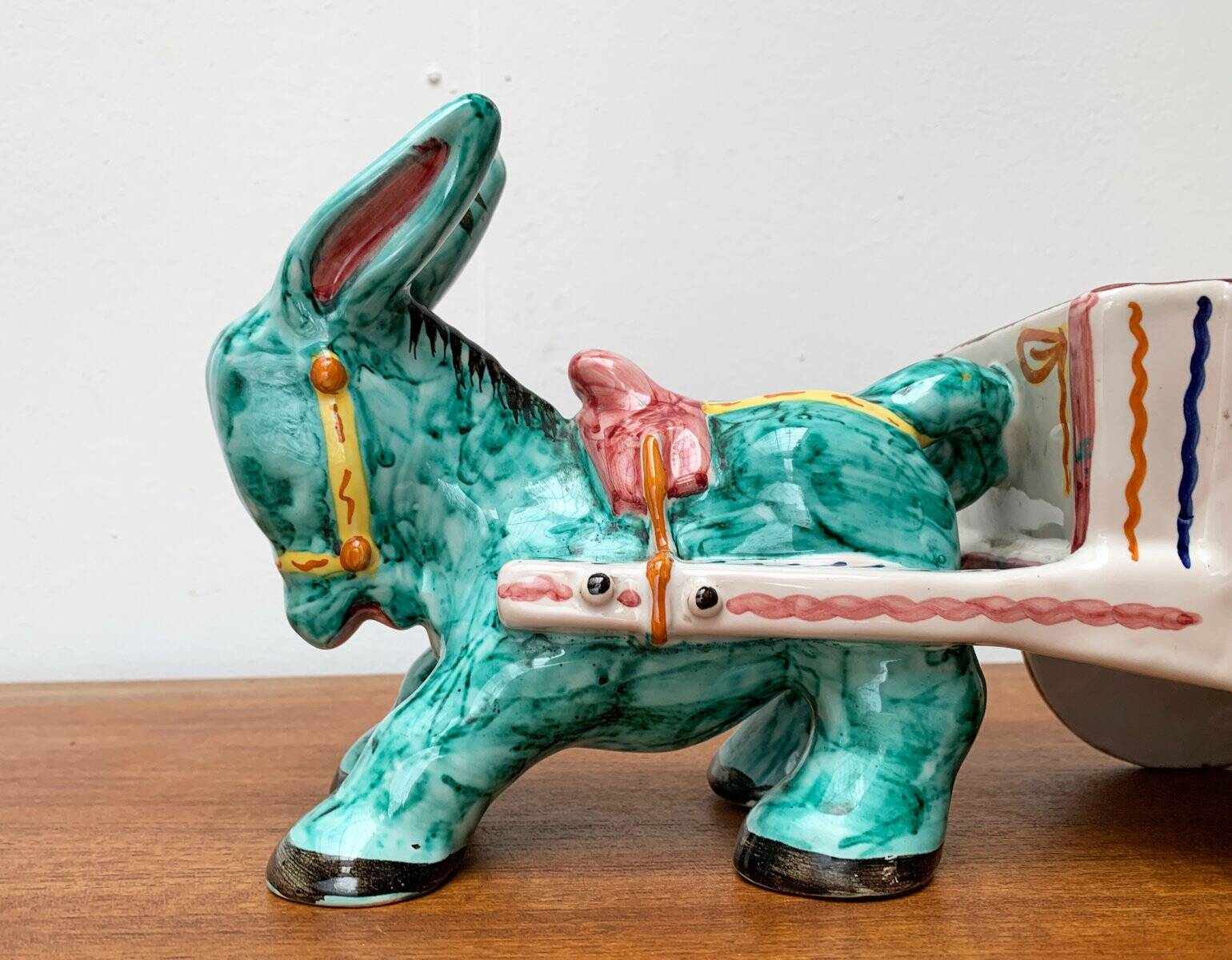 Vintage Italian hand-painted sculpture of a donkey with a cart in the shape of a bowl from Deruta, Italy.