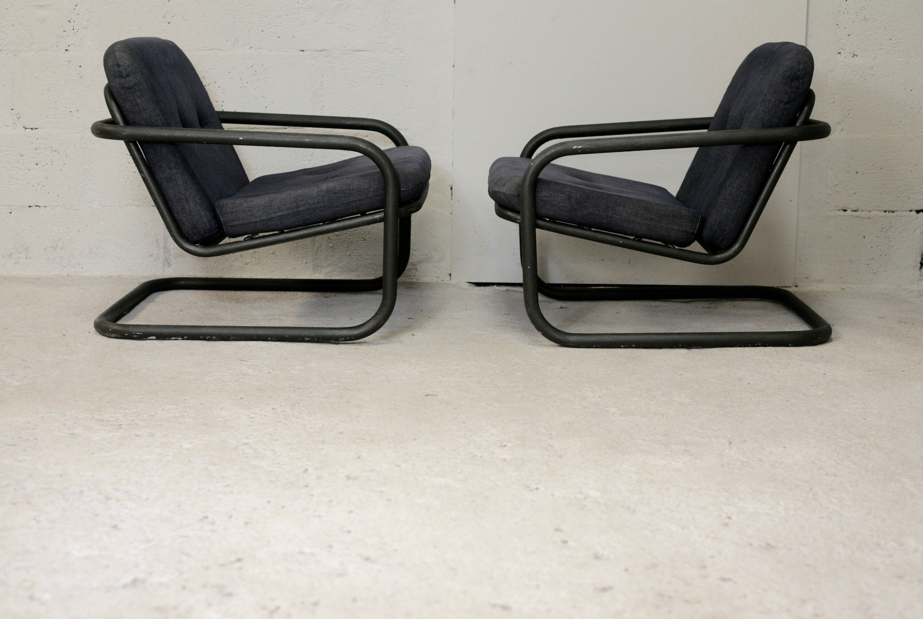 Pair of Prisunic edition armchairs, tubular steel and foam cushions, France, 1973