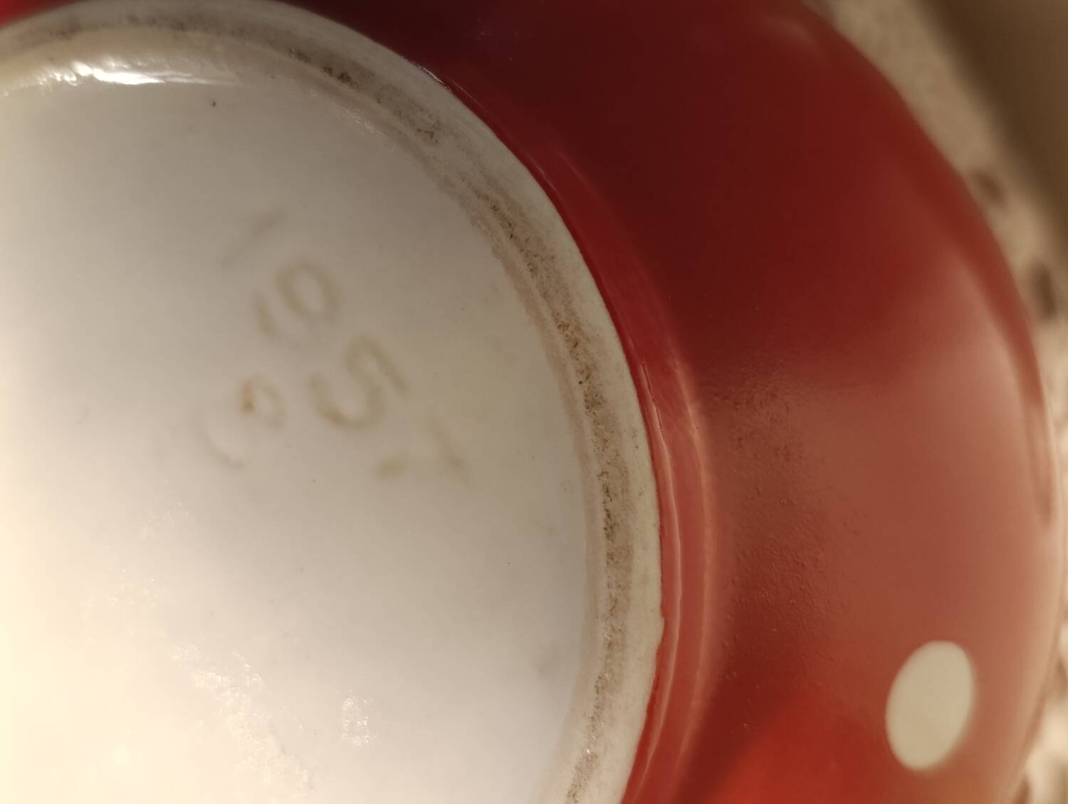 Vintage red teapot with white polka dots.