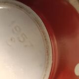 Vintage red teapot with white polka dots.