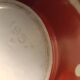 Vintage red teapot with white polka dots.