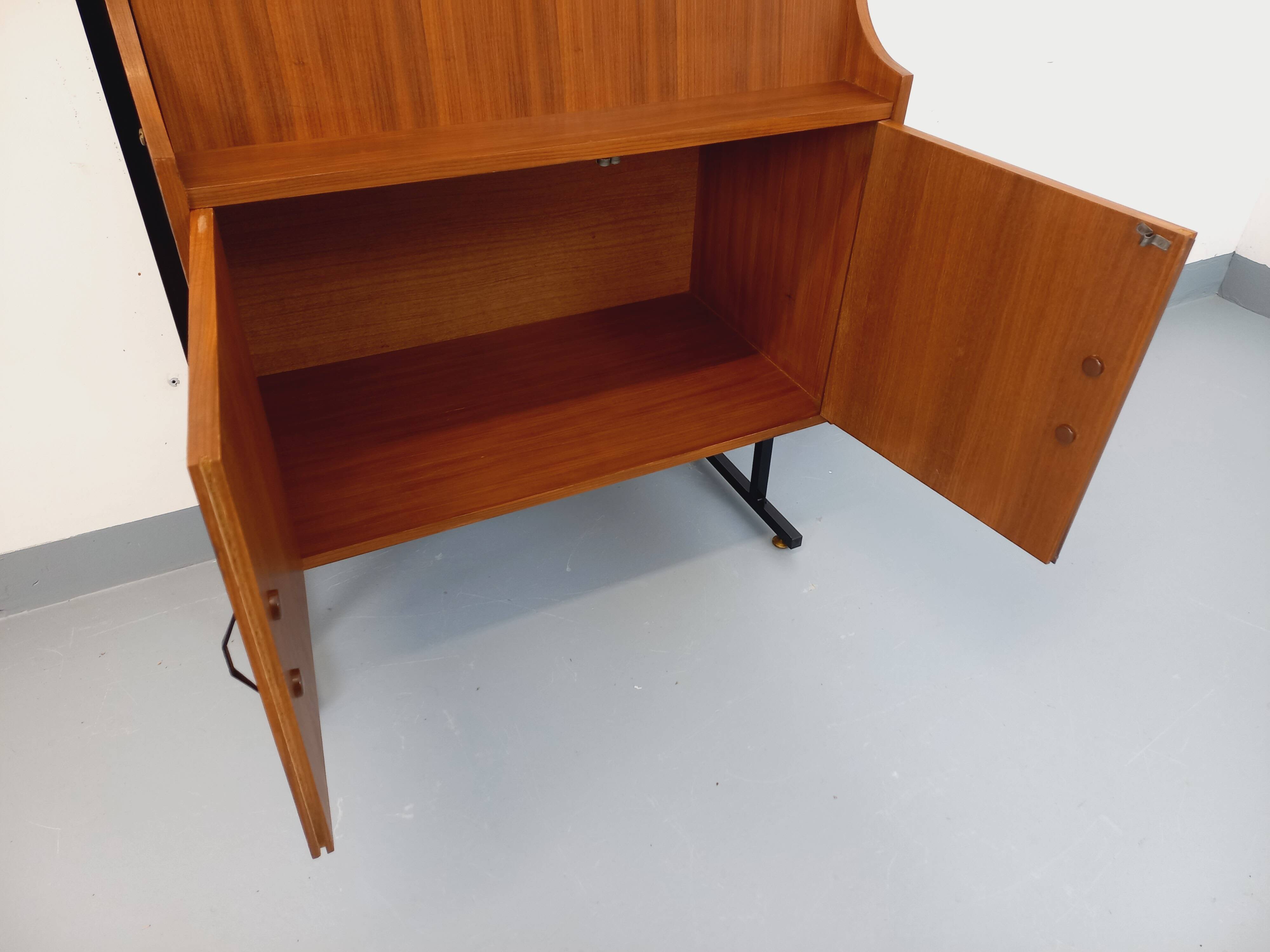 Vintage modular secretary bookshelf in teak and metal.