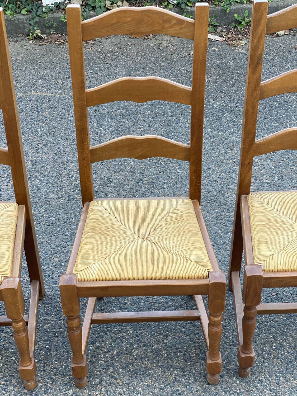 4 straw and solid wood chairs with high backs