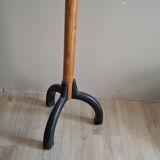 Coat rack on wood and black stand