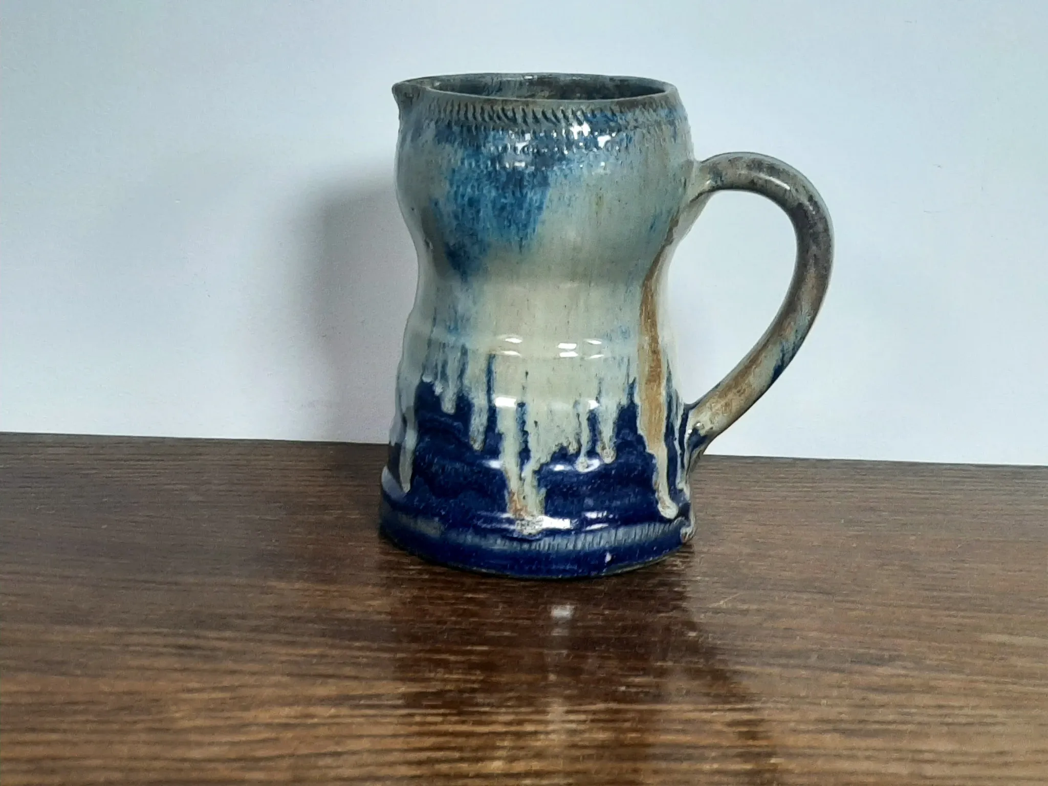 Blue flamed stoneware jug