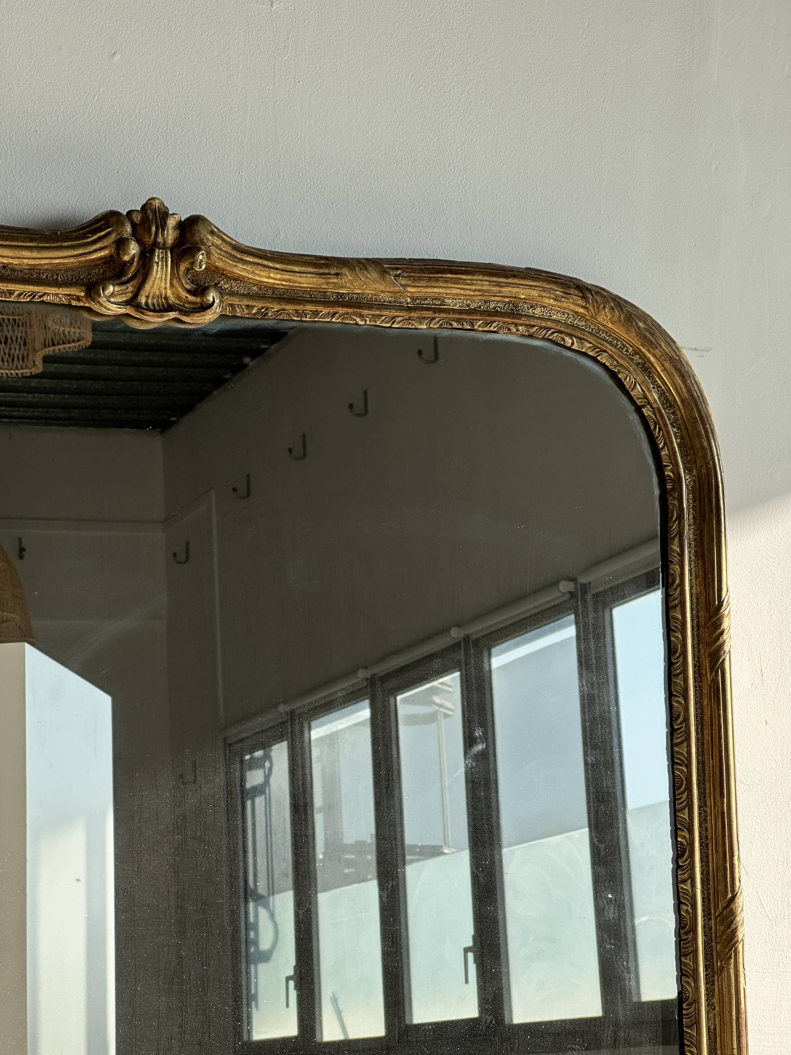 Large gilded mirror 19th century rounded corners mercury glass Louis XVI style
