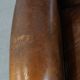Vintage sheepskin wingback chair finished with black piping