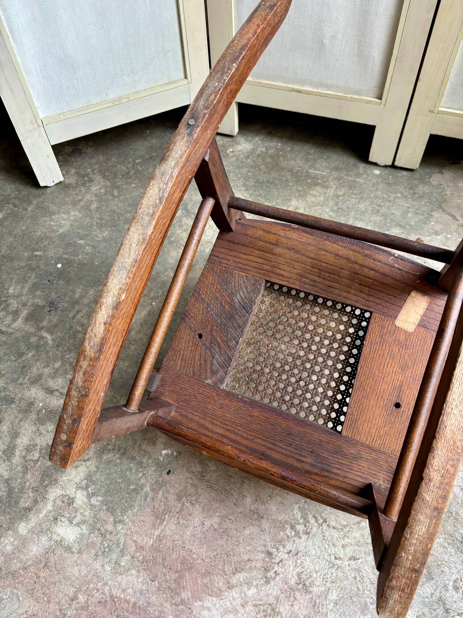 Children's rocking chair in dark wood and cane