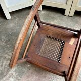 Children's rocking chair in dark wood and cane