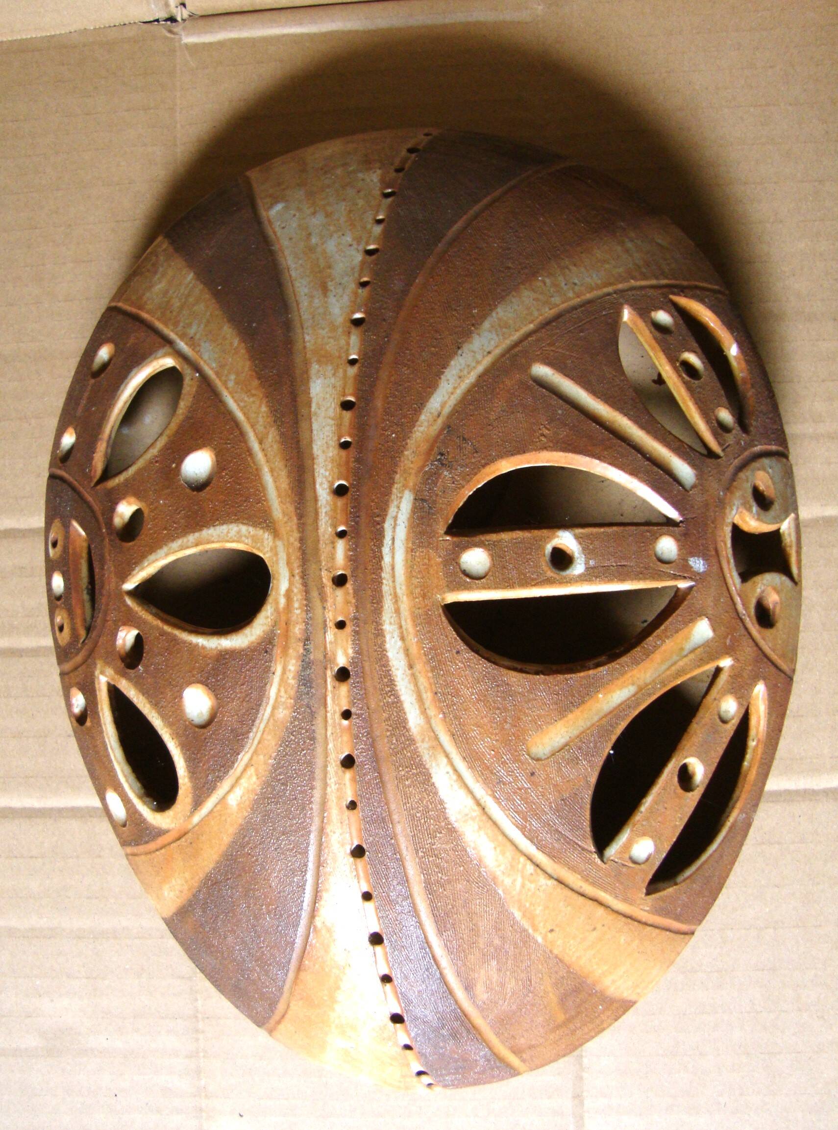 Ethnic ceramic wall lamp signed.