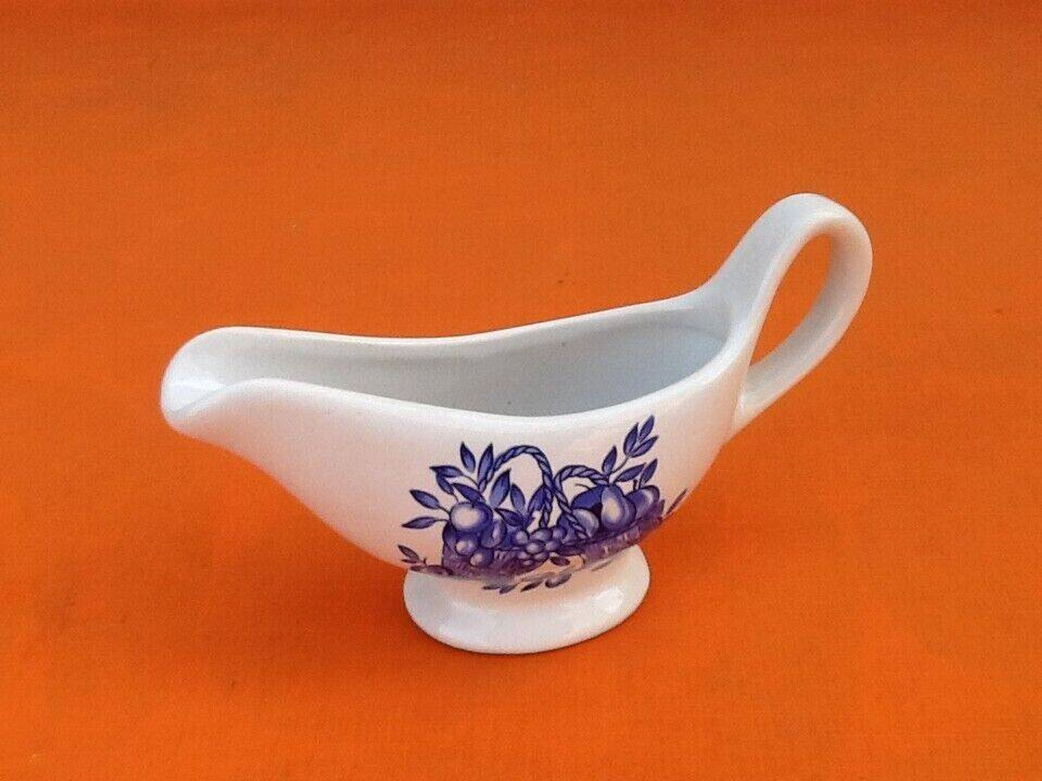 White porcelain gravy boat, fruit basket decor