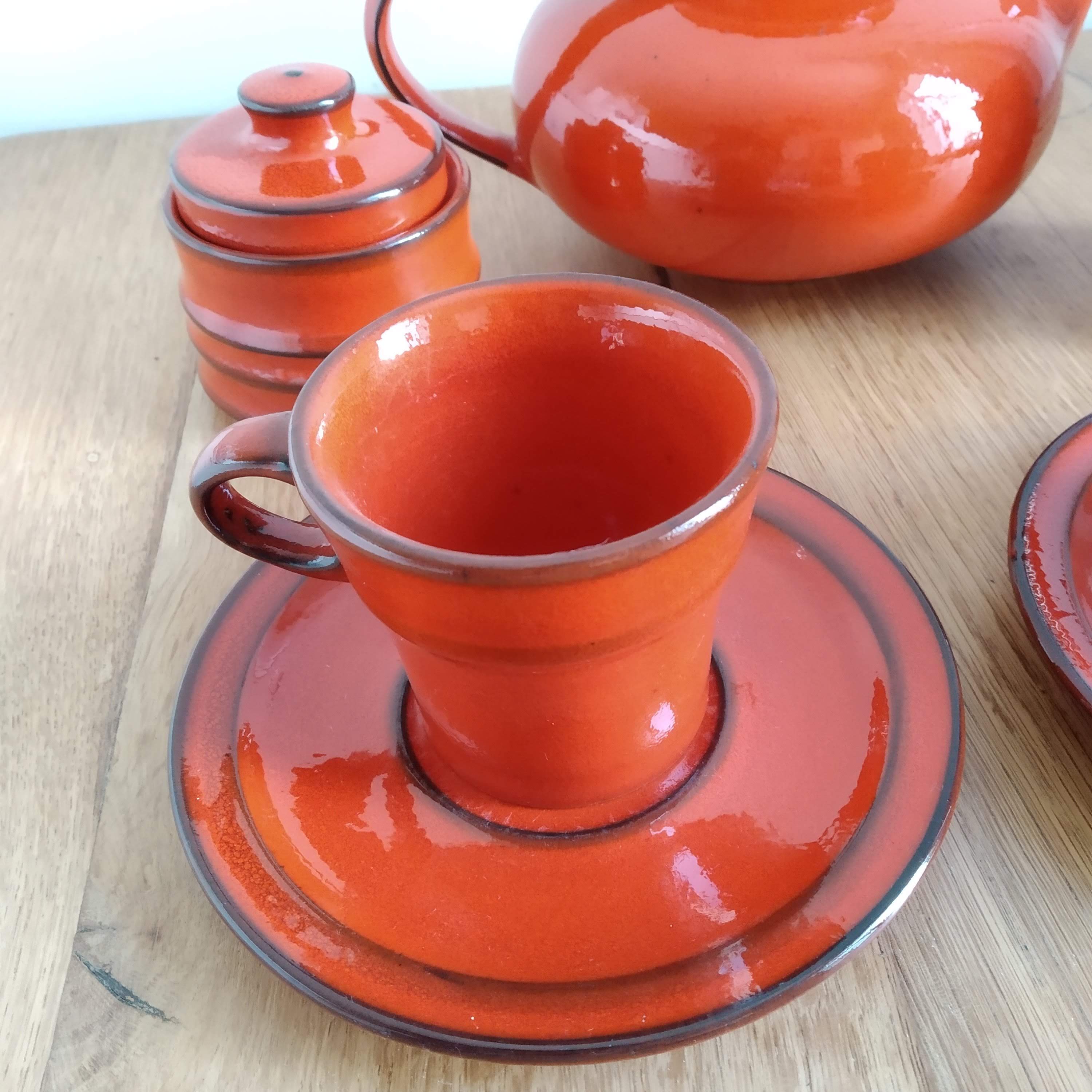 Red ceramic tea service