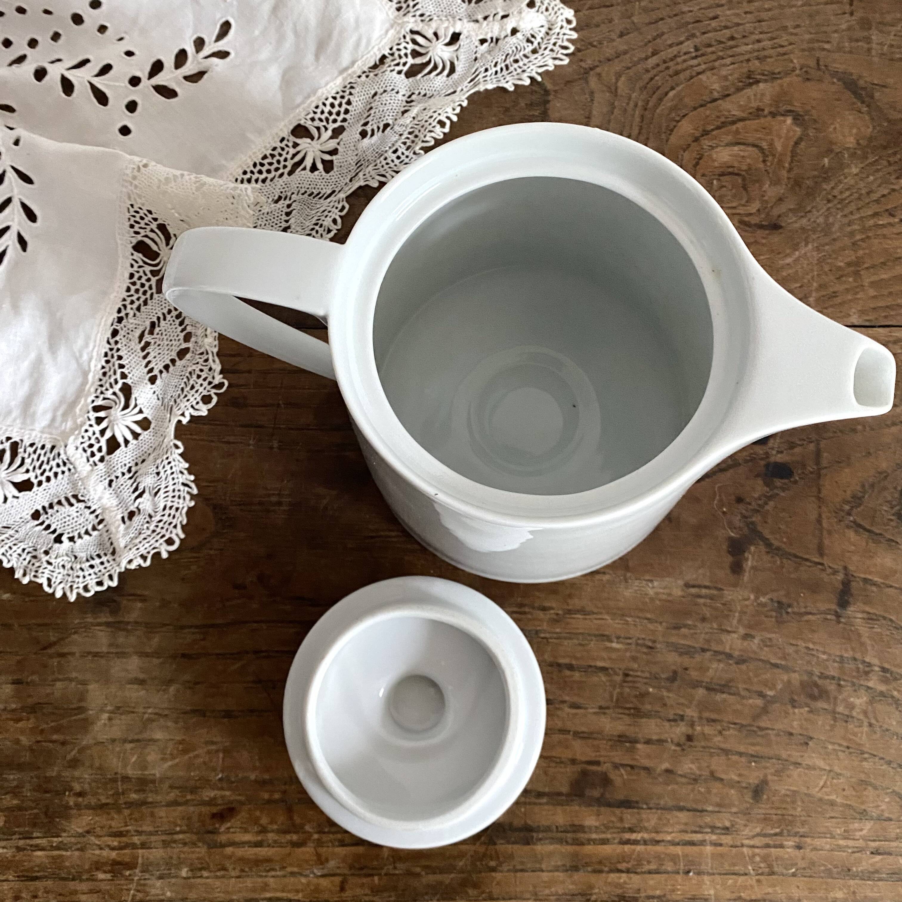 Porcelain teapot with hand-painted bird decoration