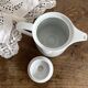 Porcelain teapot with hand-painted bird decoration