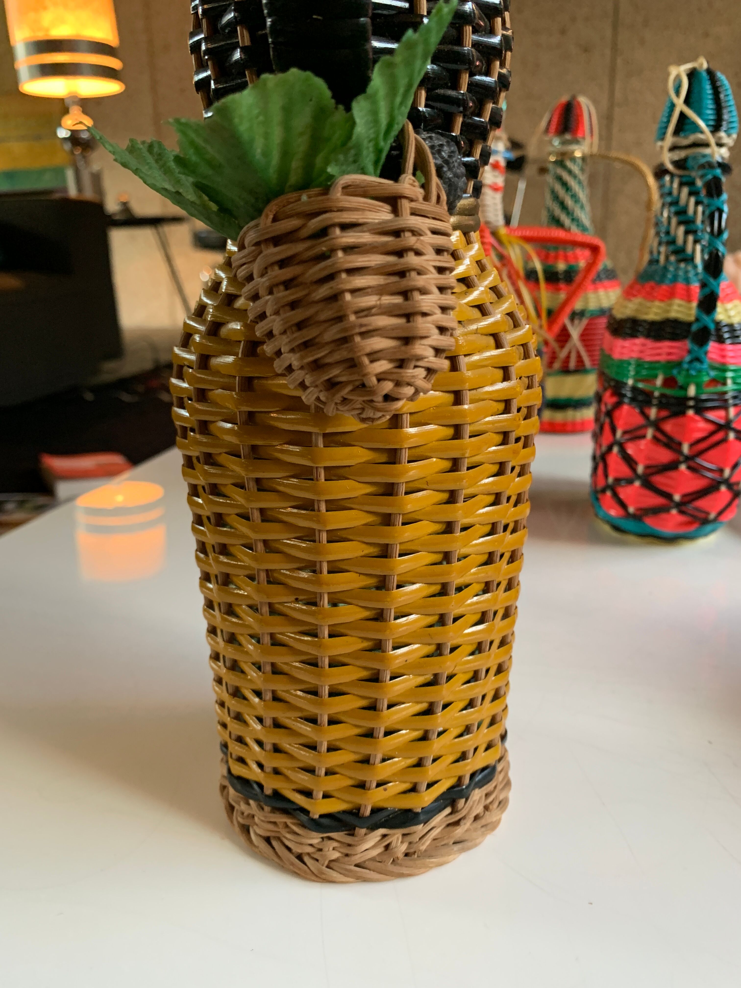 Braided bottle in anthropomorphic wicker