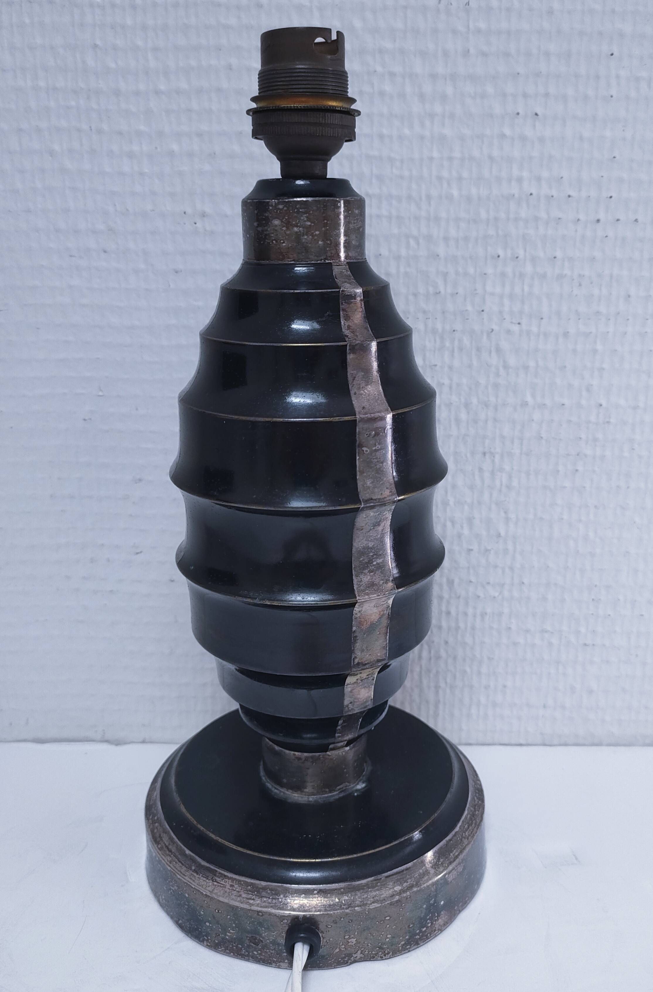 Art Deco metal lamp base with black and silver patina