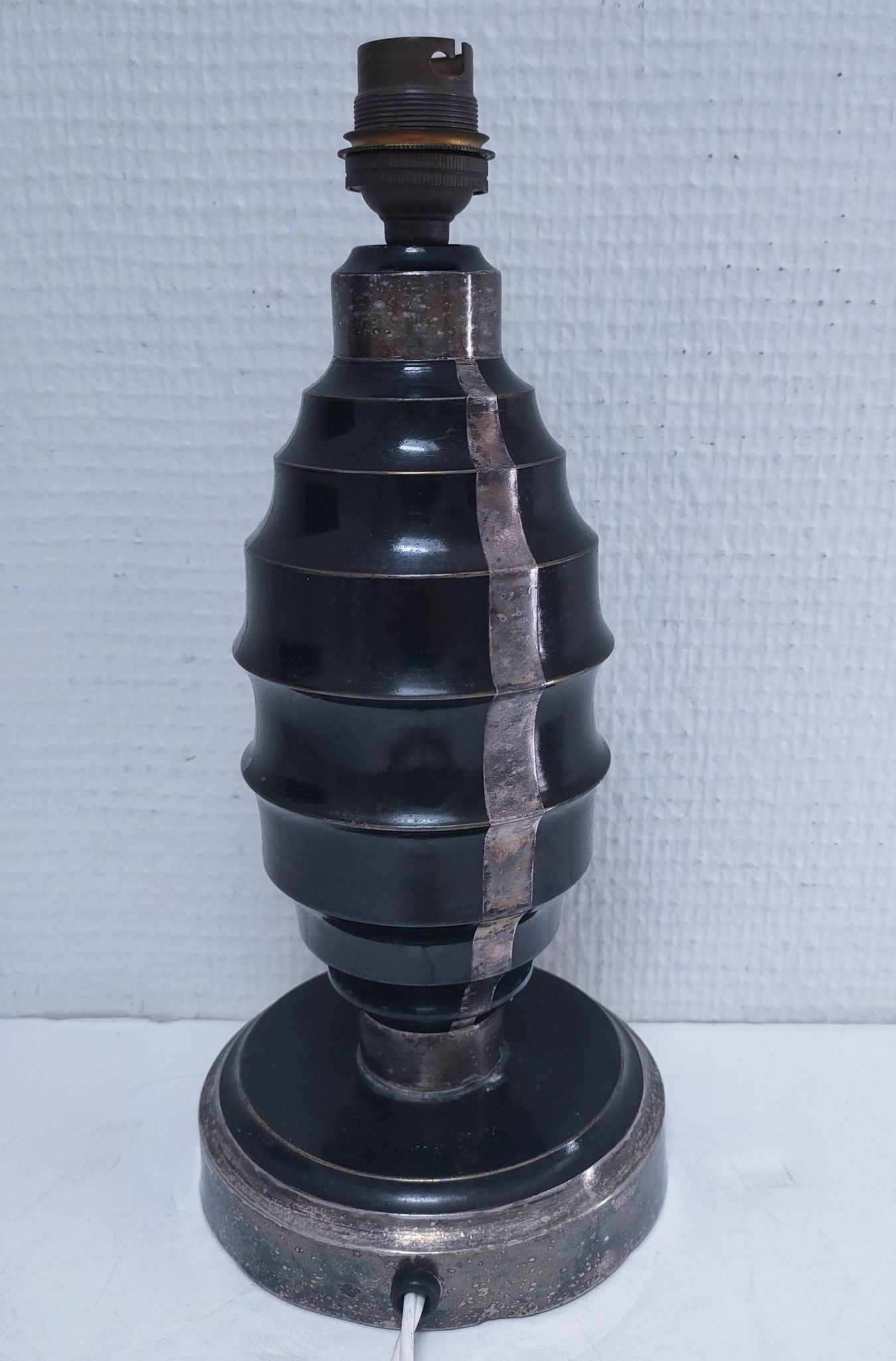 Art Deco metal lamp base with black and silver patina
