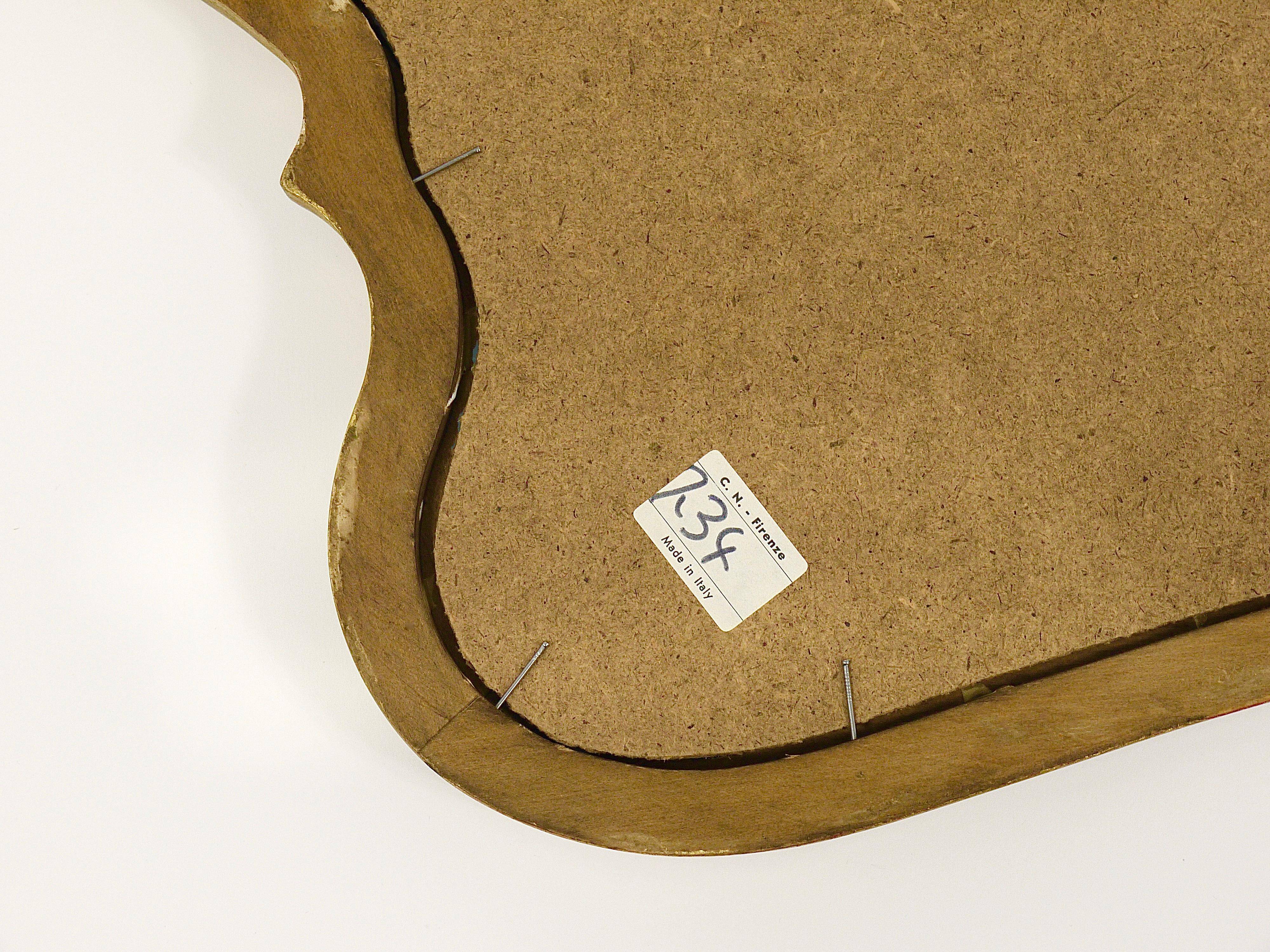 Curved wall mirror in gilded wood Chelini Firenze, mid-century, Italy, 1950s.