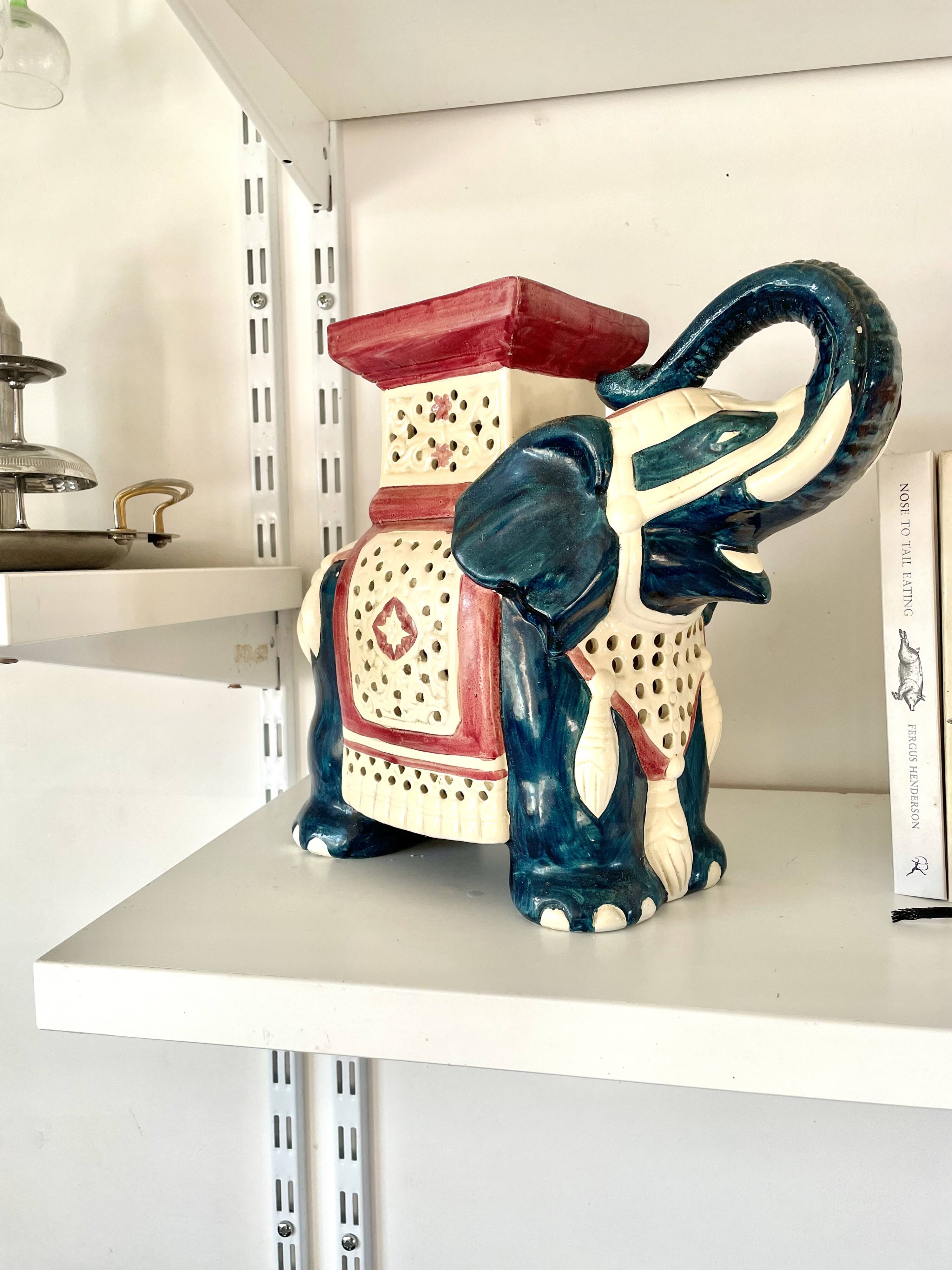 Blue and red ceramic elephant plant stand