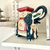 Blue and red ceramic elephant plant stand