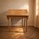 Vintage wooden writing desk with drawer, turned legs, classic style.