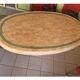 Ovoid table in pink and green travertine, circa 1975