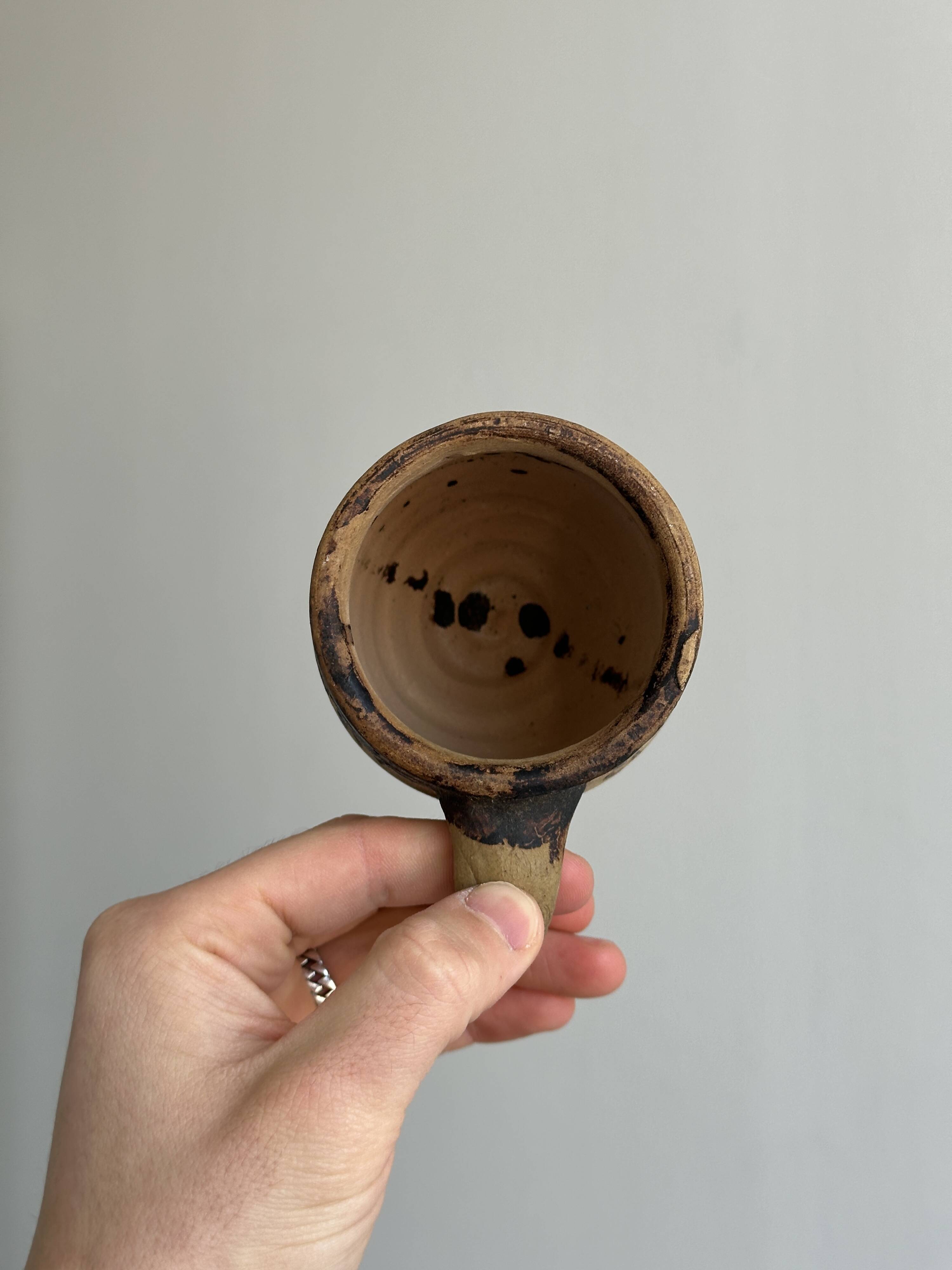 Small old terracotta cup