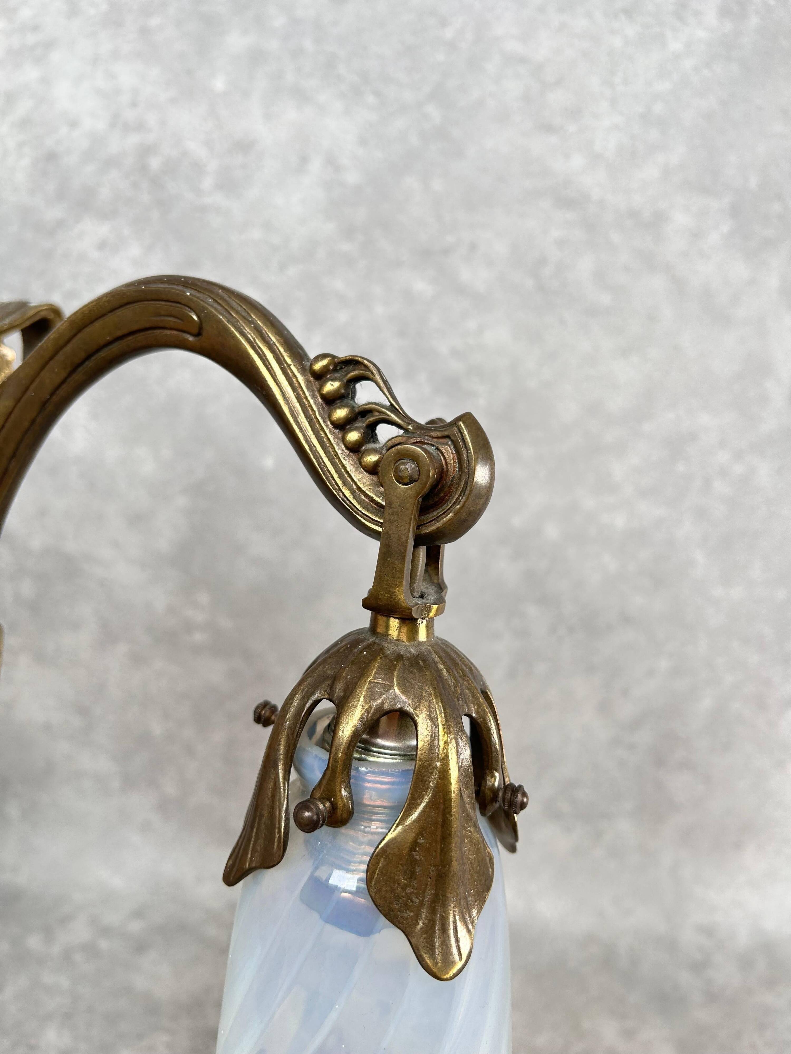 Art Nouveau wall sconces with opalescent iridescent glass
